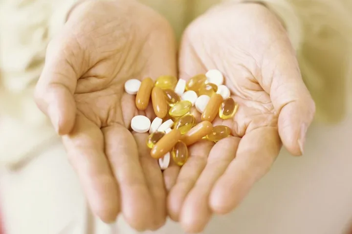 Hands holding pills