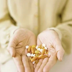 Hands holding pills
